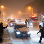 Heavy snow expected to paralyze travel tonight as angry residents and cautious officials clash over what counts as essential Update